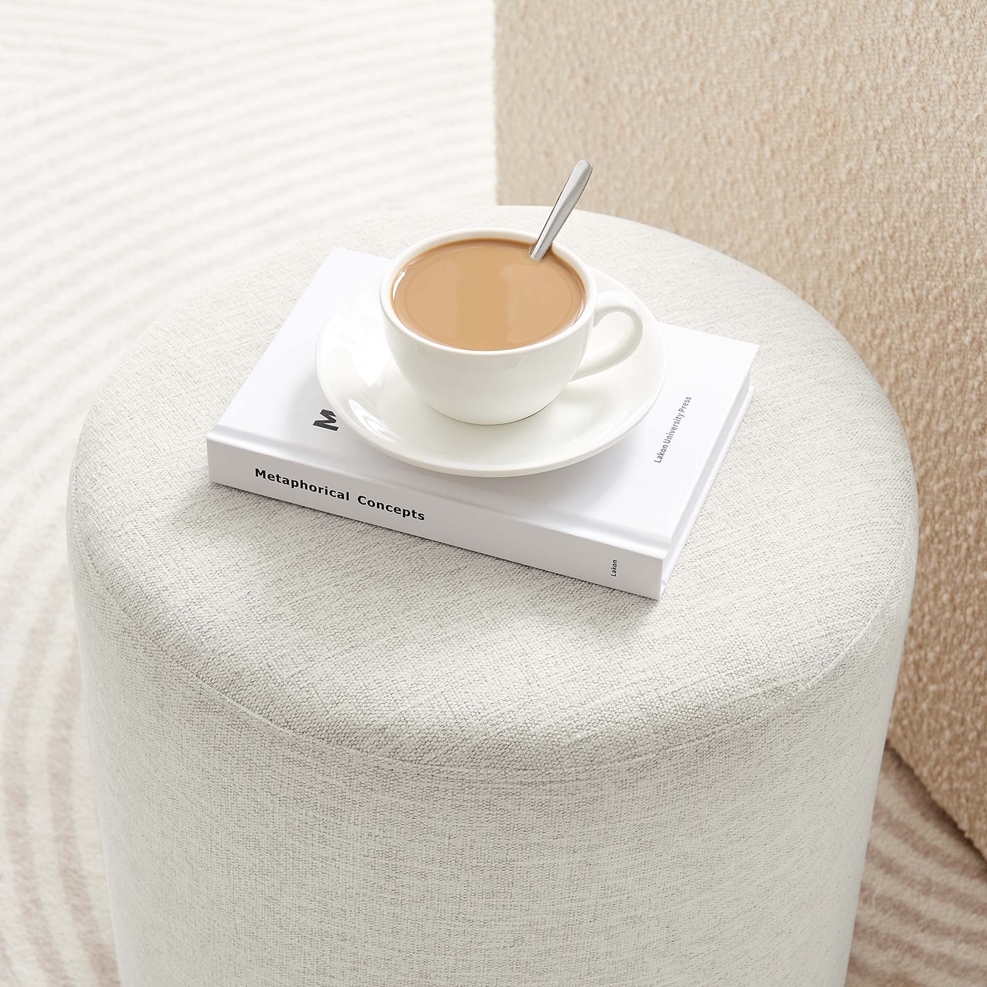 Callum 16" Round Woven Heathered Fabric Upholstered Ottoman in Heathered Weave